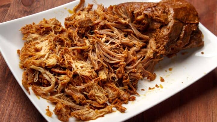 Crockpot pulled pork shoulder on a plate