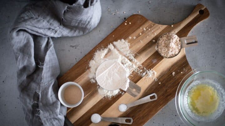 Ingredients to make honey oat bread on a counter