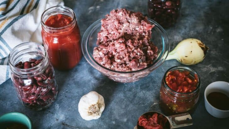 Ingredients to make venison chili on a table.