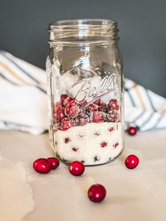 Cranberries and sugar in a jar