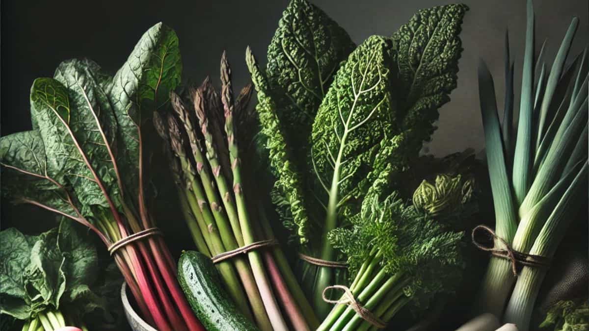 image showcasing a variety of freshly harvested perennial vegetables arranged on a rustic wooden table. The selection includes leafy greens, asparagus, rhubarb, and leeks, accented with fresh herbs like chives or oregano. Soft, dramatic lighting highlights the textures and earthy tones, creating an inviting and natural gardening theme.