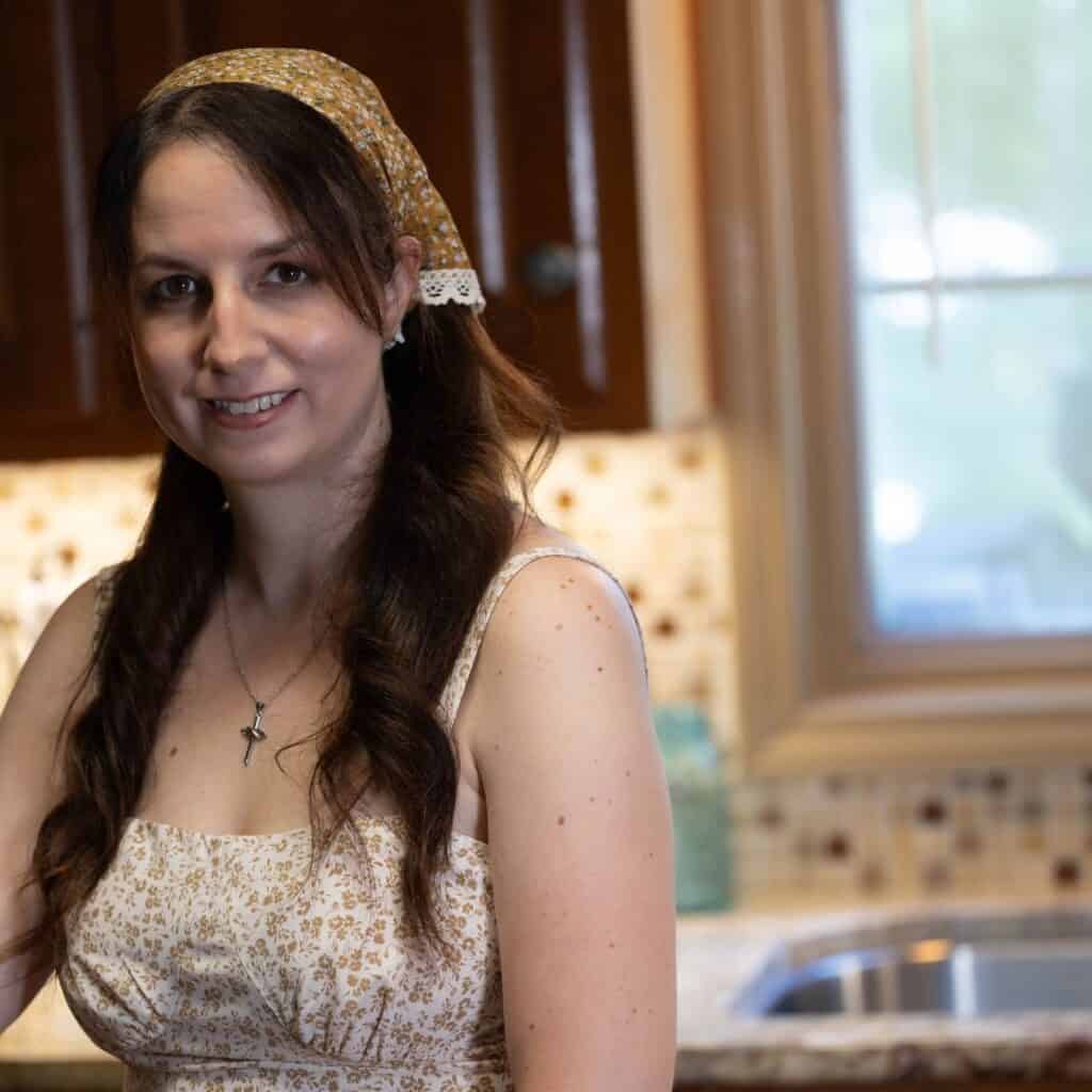 Elle McCoy of The Rustic Elk standing in her kitchen.